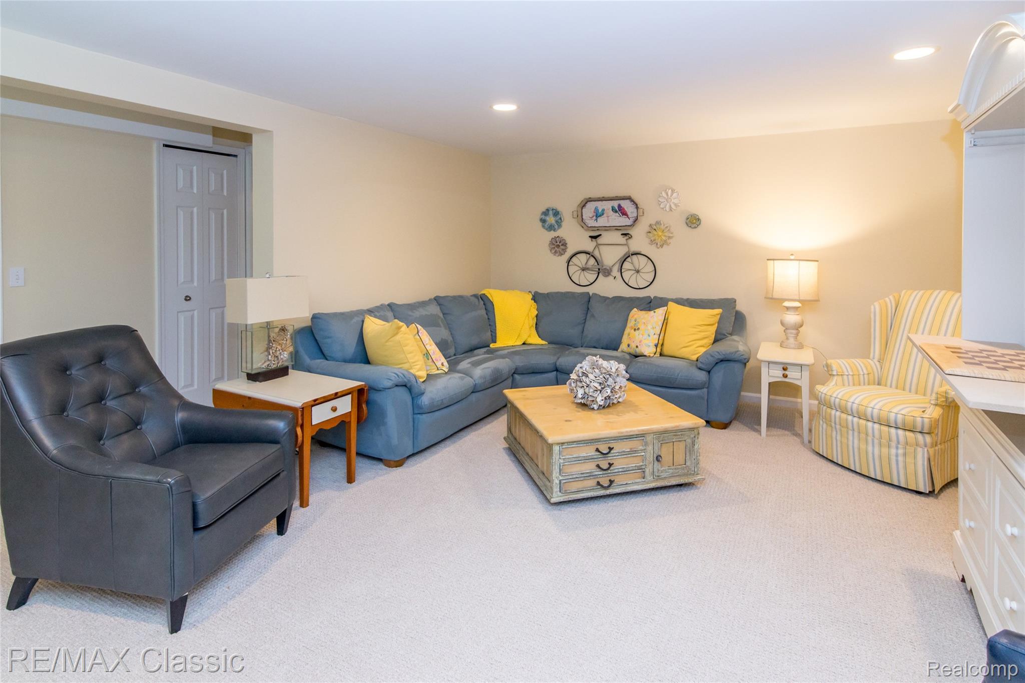 4655 Summer Ridge Drive, Unit 17 Howell, MI 48843 - Photo 11 of 34 Beautifully finished basement with a wet bar, full bathroom and bedroom with daylight window.
