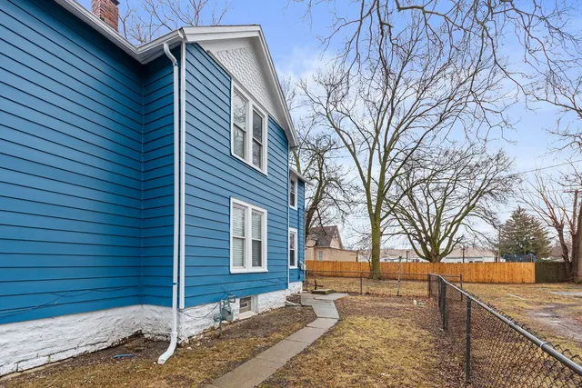 a view of a house with snow on the road