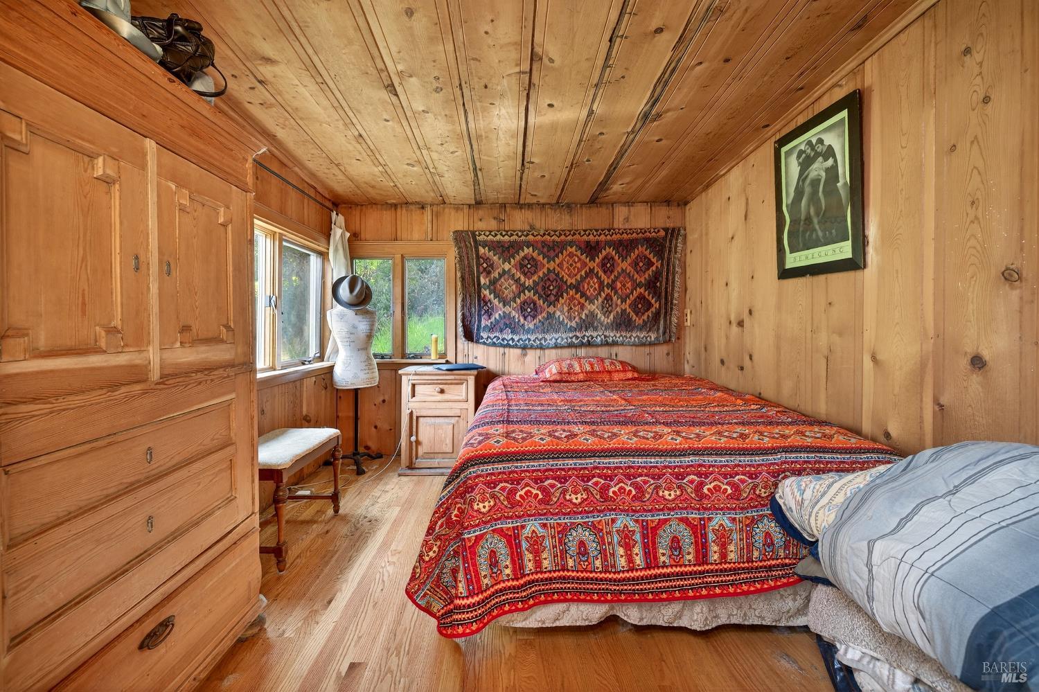 5925 Austin Creek Road Cazadero, CA 95421 - Photo 15 of 21 a bed sitting in a bedroom next to a window