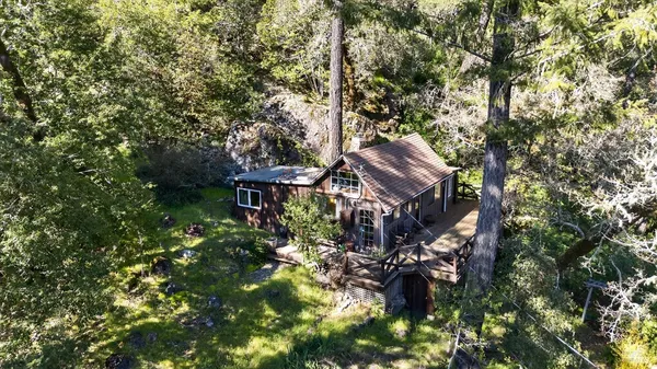 a view of a house with a tree