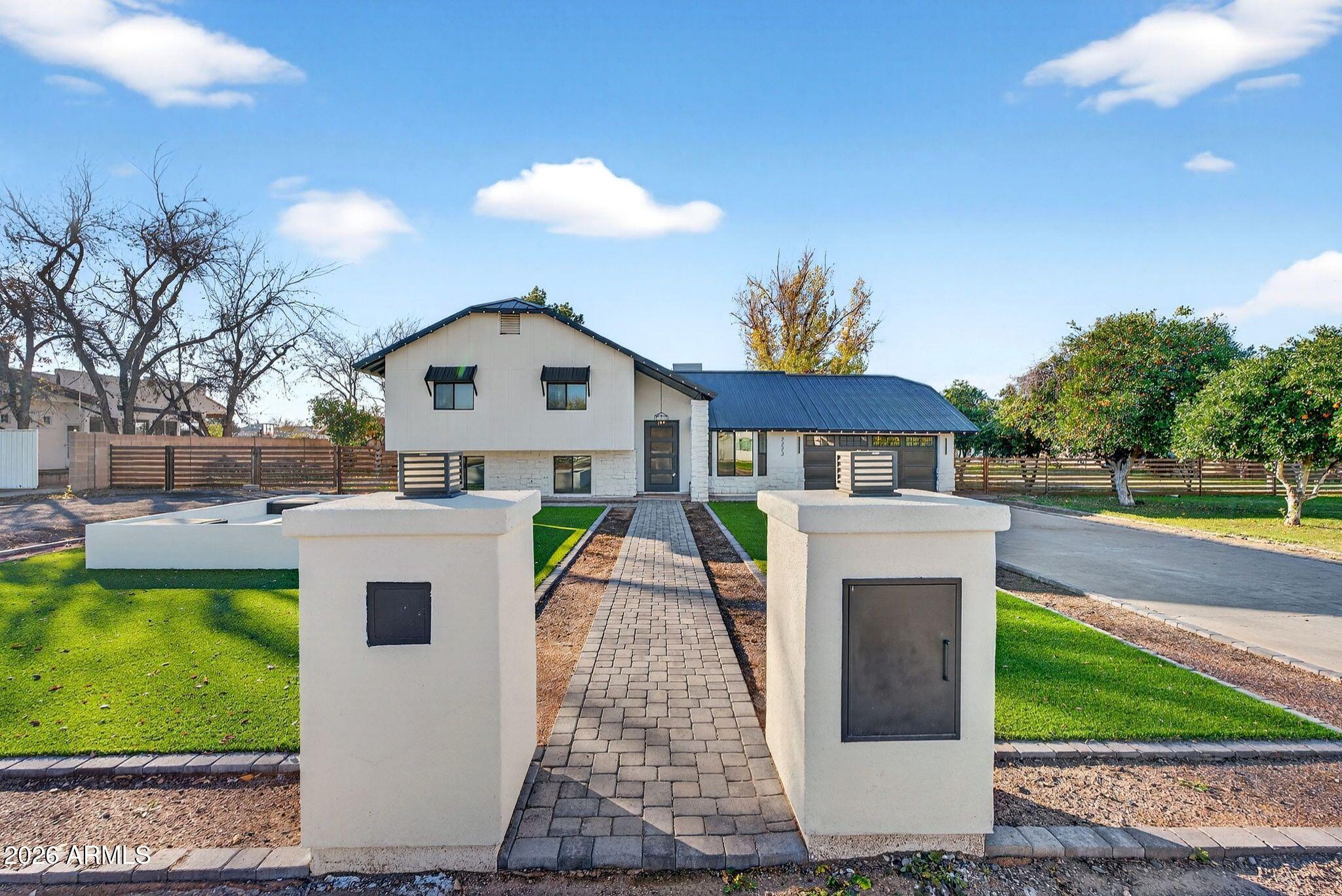 2223 East Claxton Avenue Gilbert, AZ 85297 - Photo 1 of 56 a front view of house with yard and entertaining space