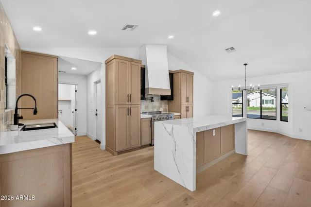 a view of a swimming pool with a lounge chairs
