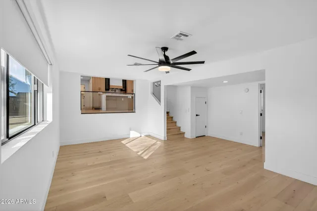a view of empty room with a fireplace