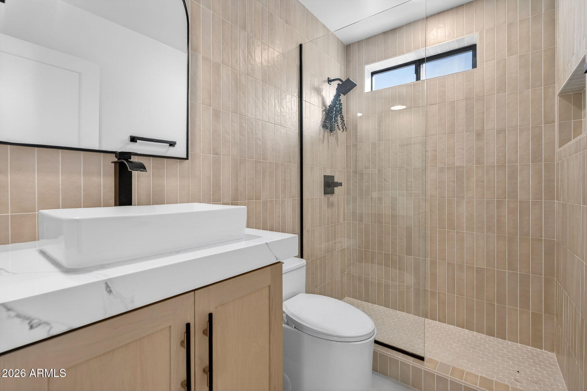 2223 East Claxton Avenue Gilbert, AZ 85297 - Photo 21 of 56 a bathroom with a sink a toilet and shower