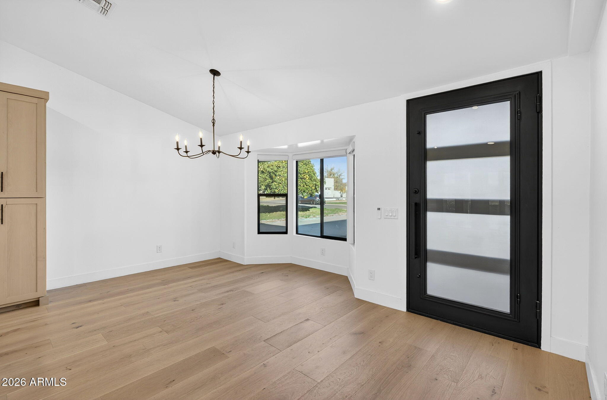 2223 East Claxton Avenue Gilbert, AZ 85297 - Photo 24 of 56 a view of empty room with wooden floor and fan