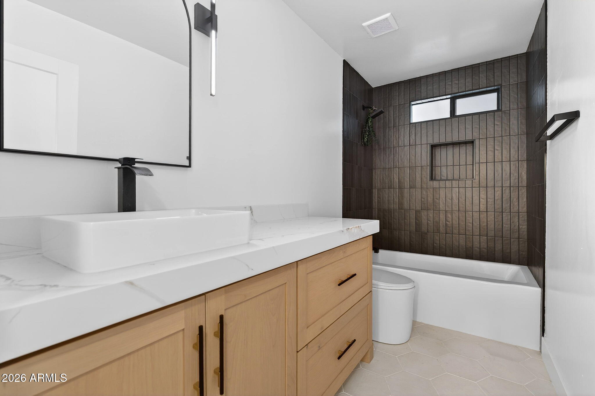 2223 East Claxton Avenue Gilbert, AZ 85297 - Photo 26 of 56 a bathroom with a sink a toilet and shower