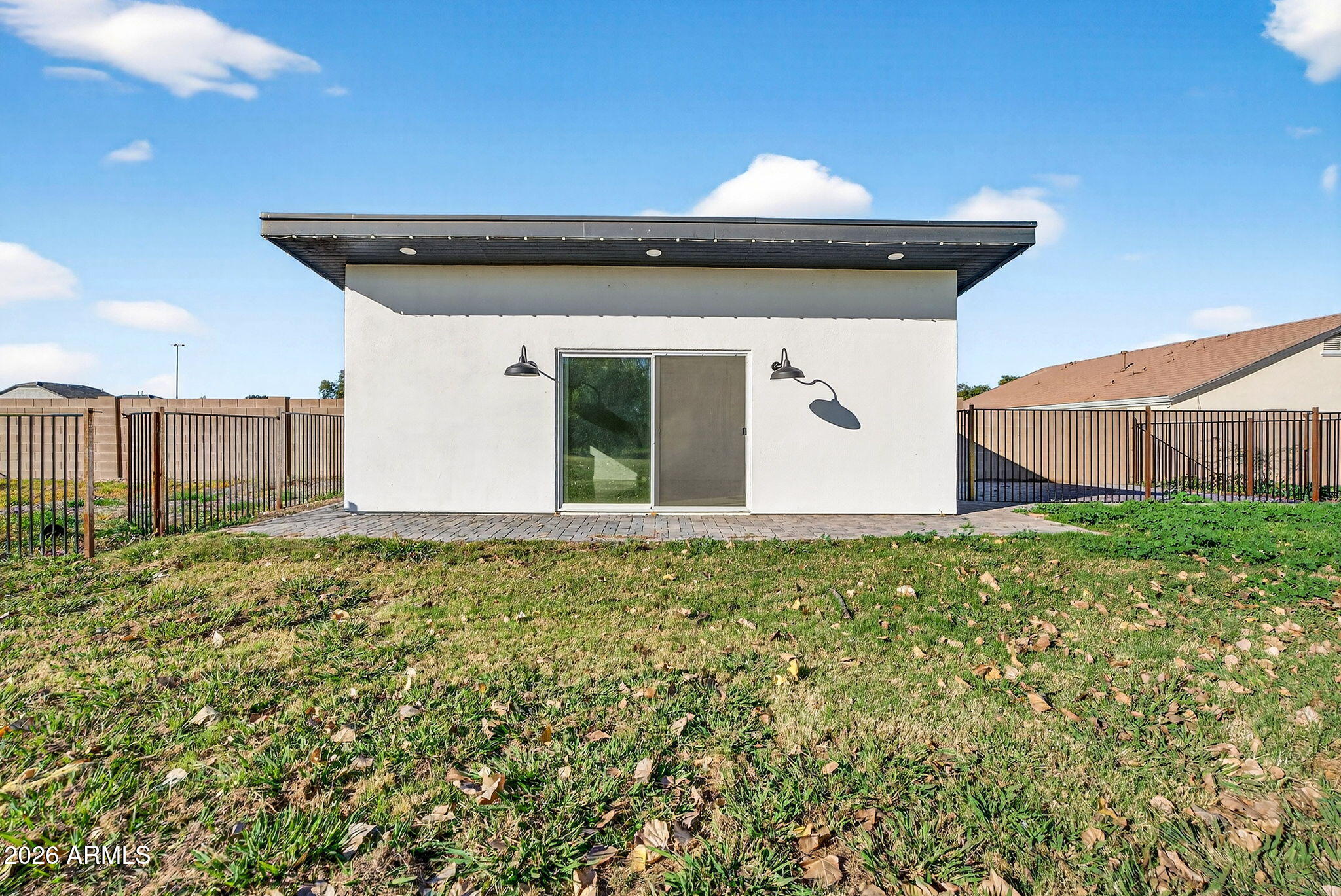 2223 East Claxton Avenue Gilbert, AZ 85297 - Photo 2 of 56 a front view of a house with garden