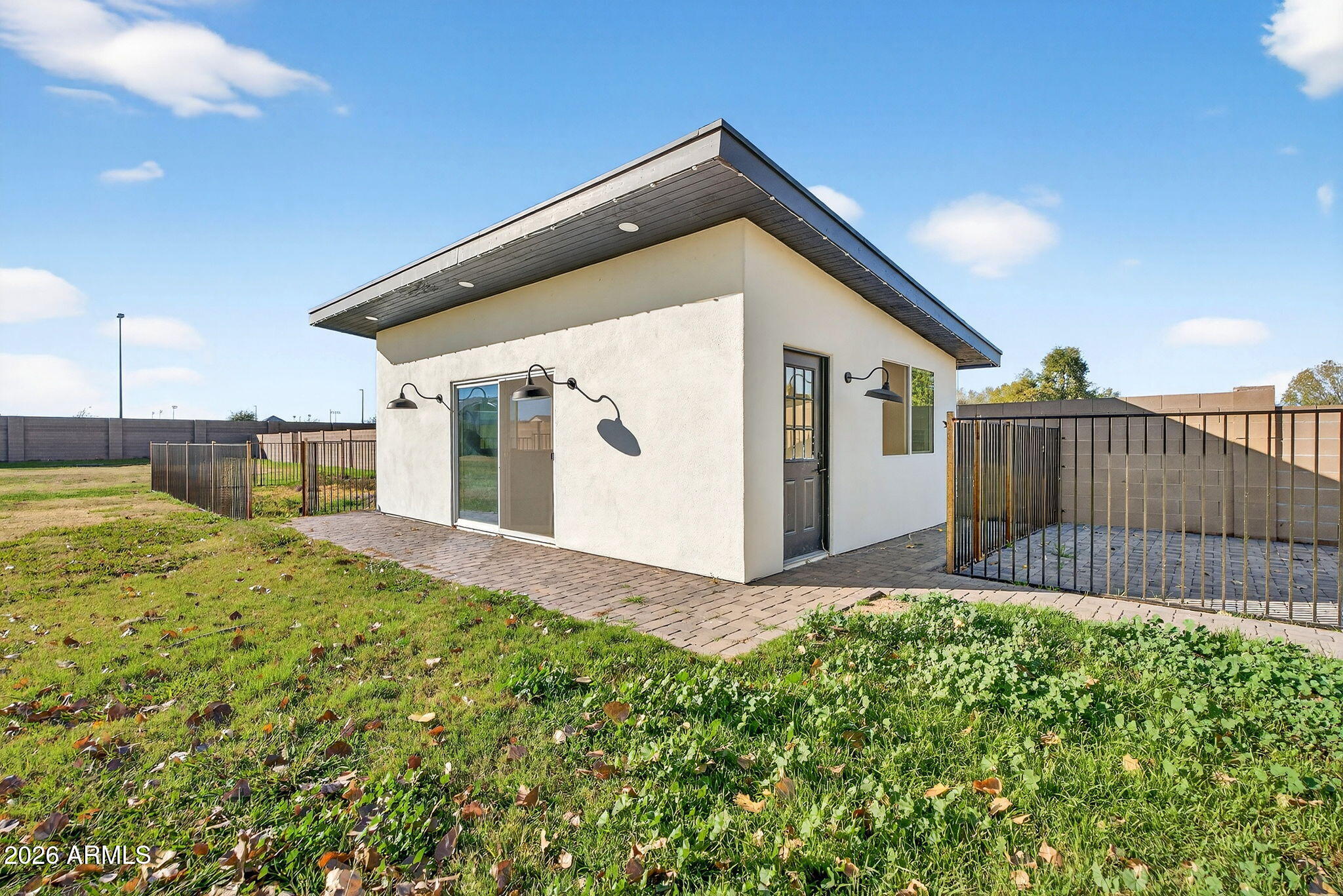 2223 East Claxton Avenue Gilbert, AZ 85297 - Photo 36 of 56 a view of a backyard with a garden and deck
