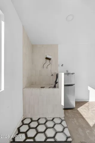 a bathroom with a bathtub and a sink