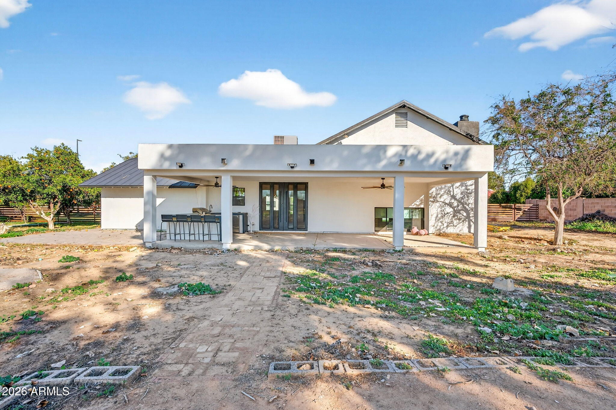 2223 East Claxton Avenue Gilbert, AZ 85297 - Photo 41 of 56 a view of a house with a yard and garage
