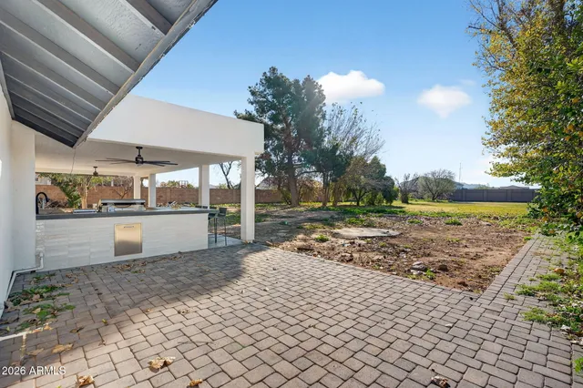 a view of a backyard of the house