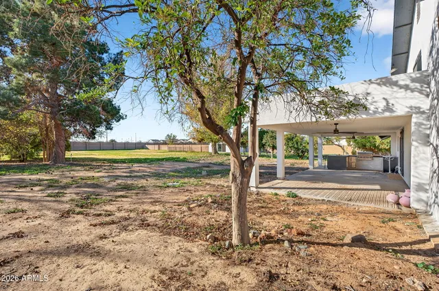 a bedroom with a bed and large window