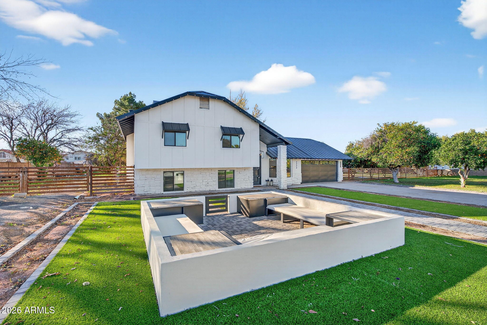 2223 East Claxton Avenue Gilbert, AZ 85297 - Photo 3 of 56 a view of a house with a yard