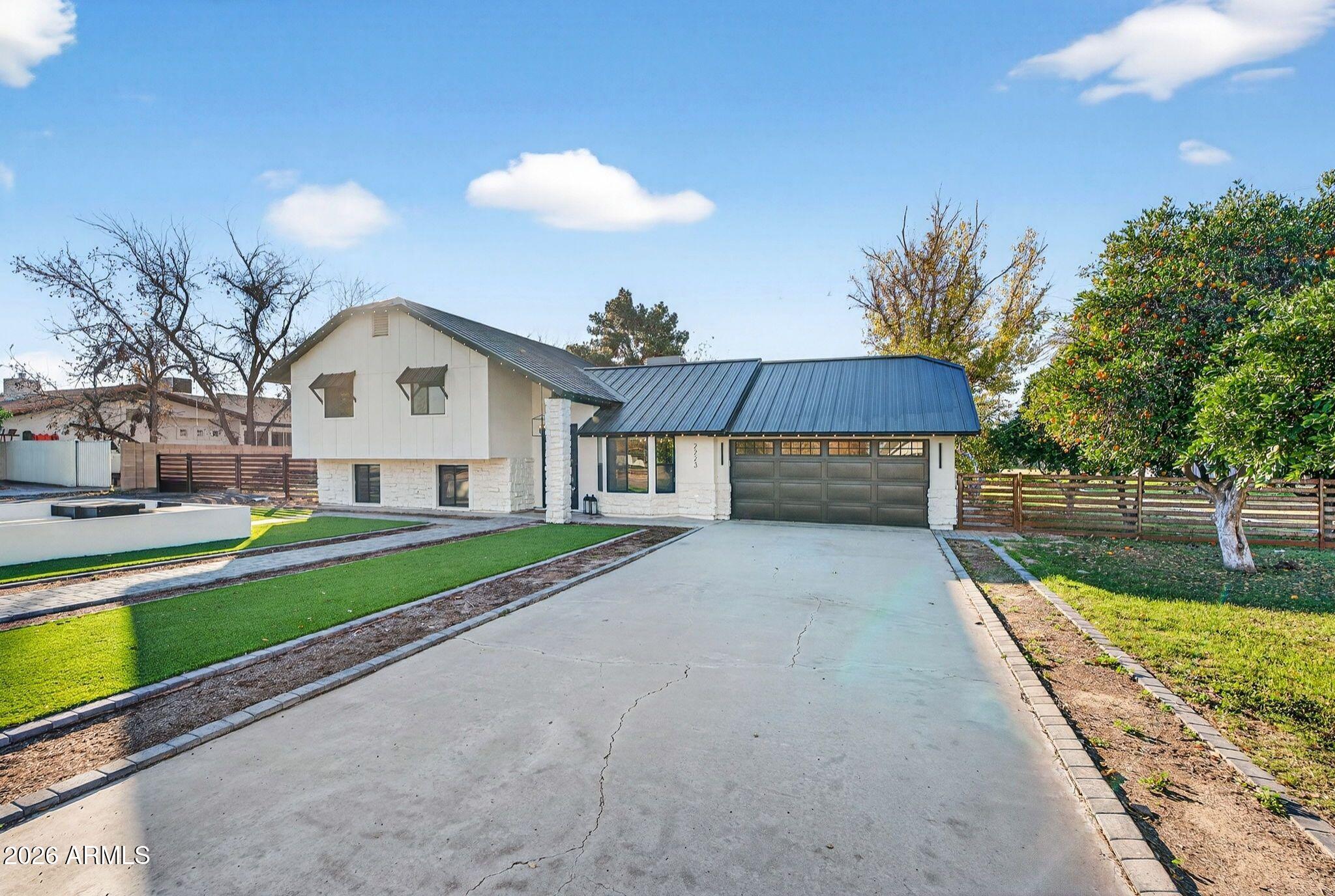 2223 East Claxton Avenue Gilbert, AZ 85297 - Photo 4 of 56 a view of house with outdoor space and swimming pool