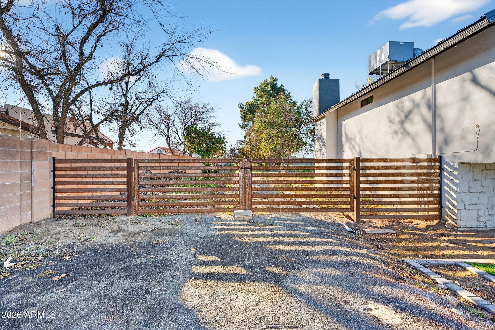 2223 East Claxton Avenue Gilbert, AZ 85297 - Photo 5 of 56 a view of a back yard of the house