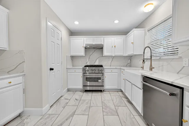 a kitchen with a cabinets and appliances