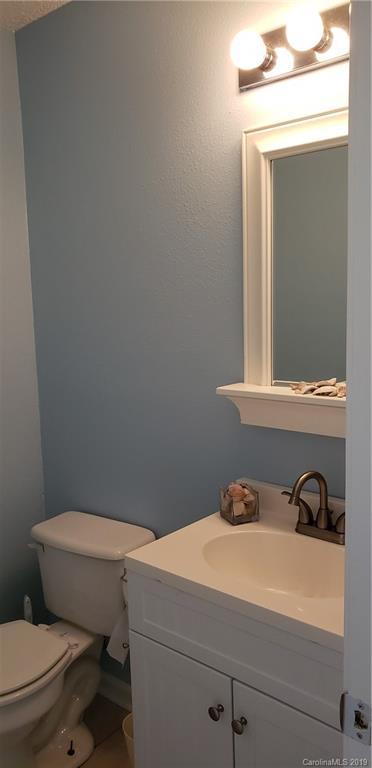 4489 Norfleet Street Concord, NC 28025 - Photo 11 of 23 a bathroom with a toilet and a sink