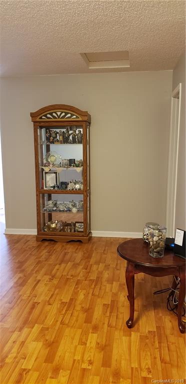 4489 Norfleet Street Concord, NC 28025 - Photo 14 of 23 a room with a table and a stove