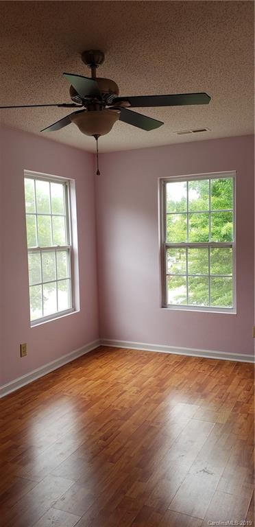 4489 Norfleet Street Concord, NC 28025 - Photo 17 of 23 an empty room with wooden floor and windows