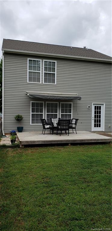 4489 Norfleet Street Concord, NC 28025 - Photo 19 of 23 a front view of a house with swimming pool having outdoor seating