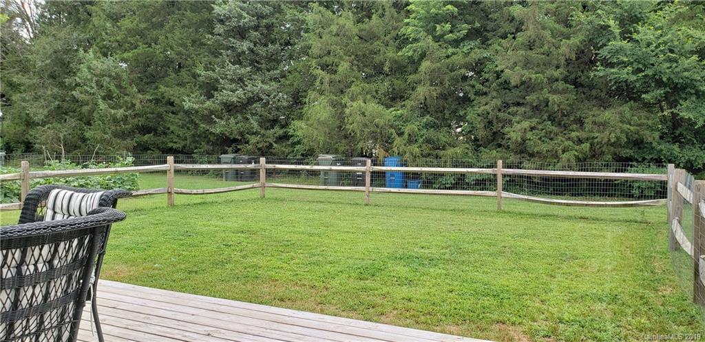 4489 Norfleet Street Concord, NC 28025 - Photo 20 of 23 a view of a deck with a big yard