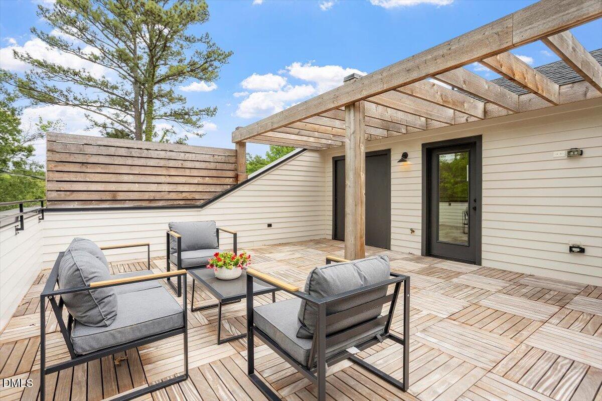 811 Maple Berry Lane, Unit 101 Raleigh, NC 27607 - Photo 39 of 45 a view of a patio with couple of chairs and a fire pit