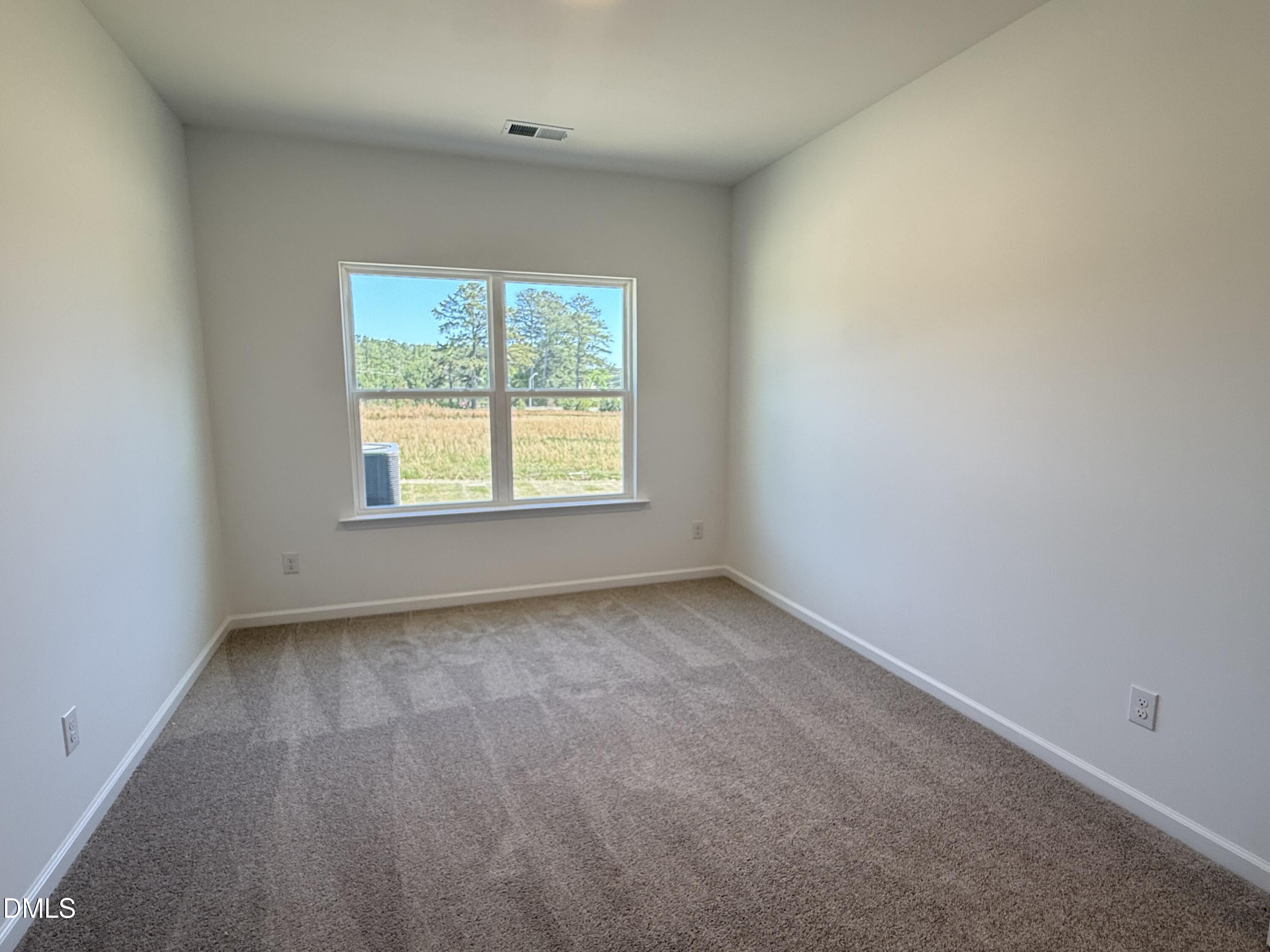 433 Contempo Court, Unit 3 Rolesville, NC 27571 - Photo 13 of 40 an empty room with a window
