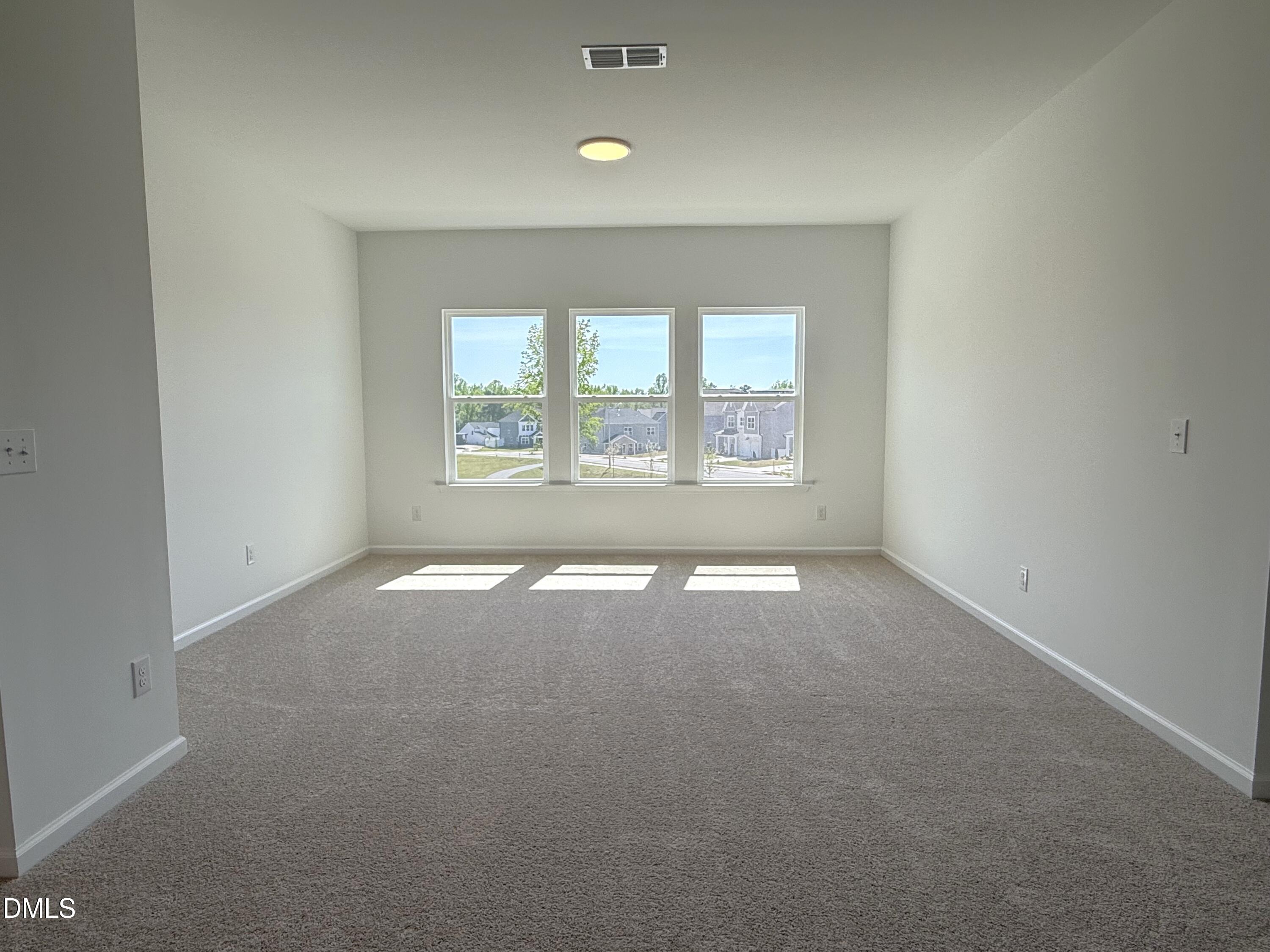 433 Contempo Court, Unit 3 Rolesville, NC 27571 - Photo 15 of 40 an empty room with a empty space and windows