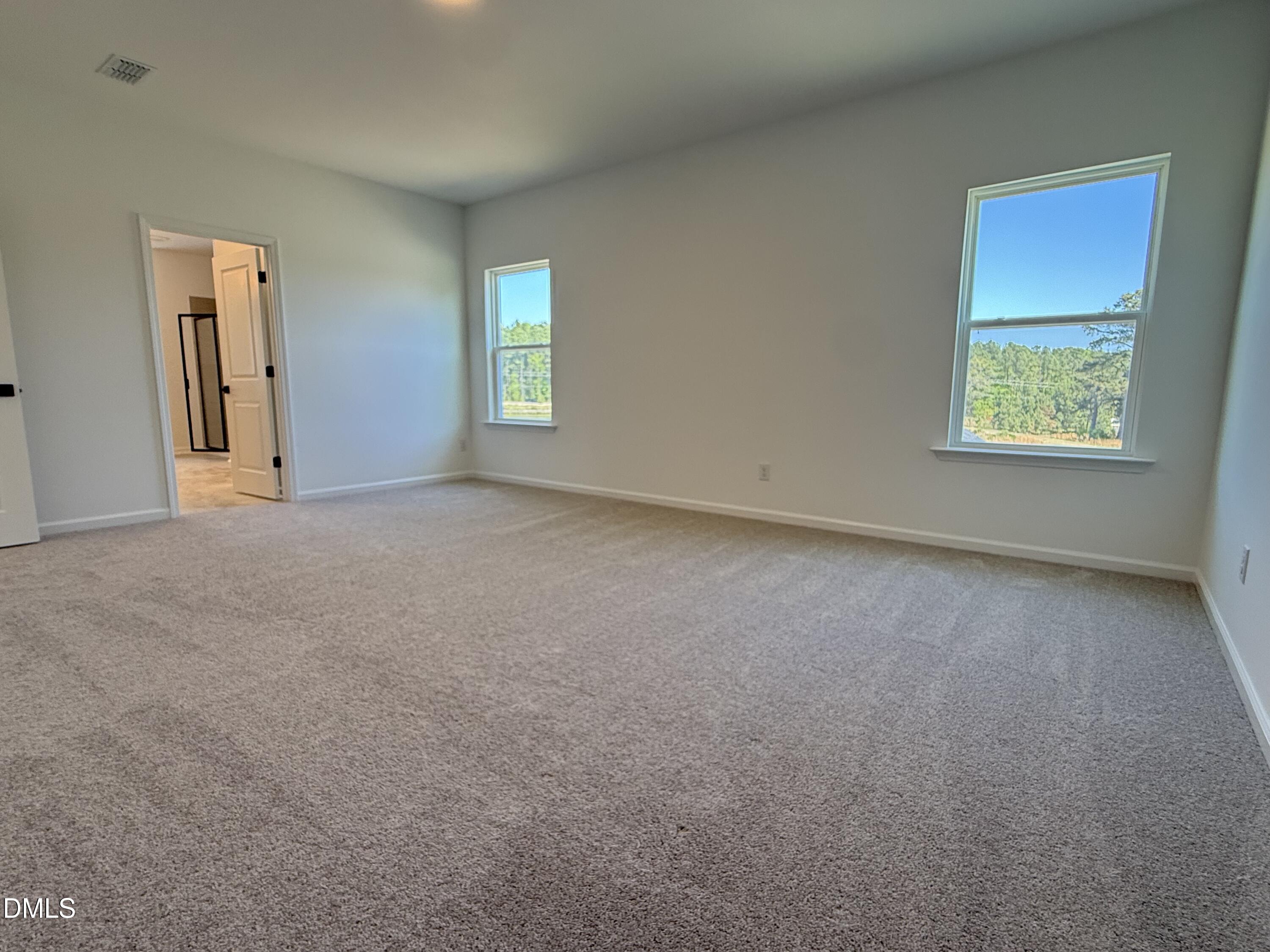 433 Contempo Court, Unit 3 Rolesville, NC 27571 - Photo 17 of 40 an empty room with windows