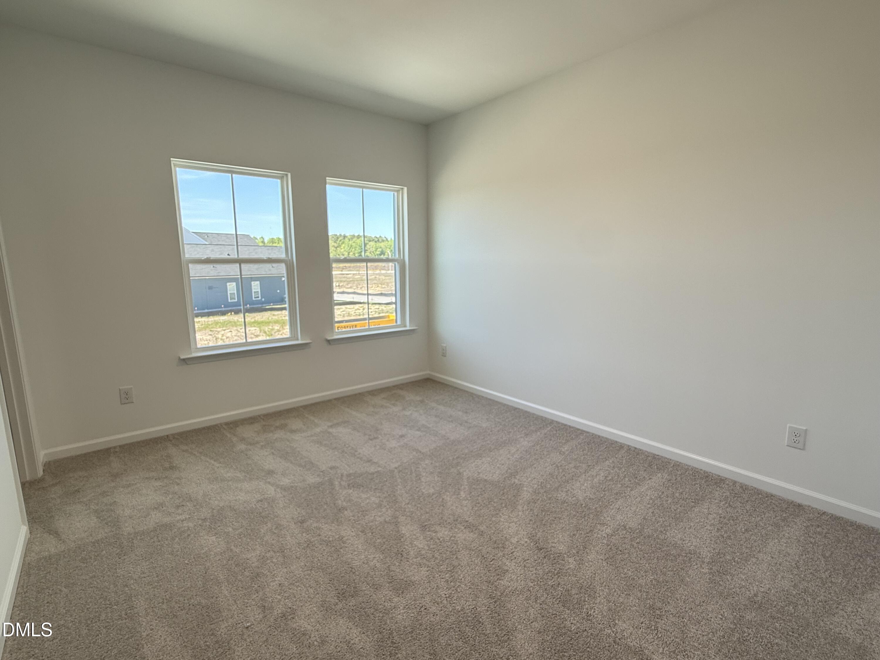 433 Contempo Court, Unit 3 Rolesville, NC 27571 - Photo 24 of 40 an empty room with a window