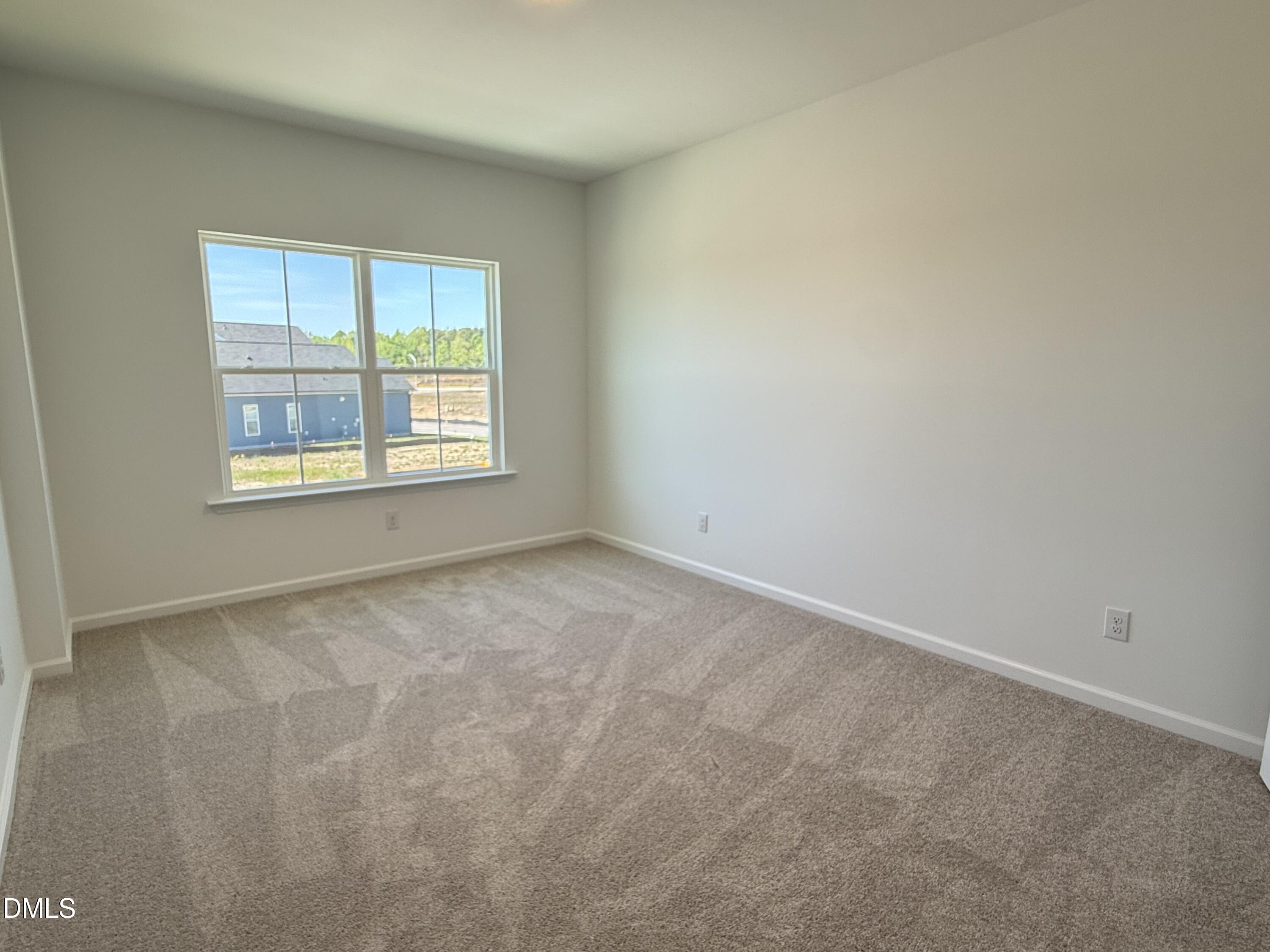 433 Contempo Court, Unit 3 Rolesville, NC 27571 - Photo 25 of 40 an empty room with a window