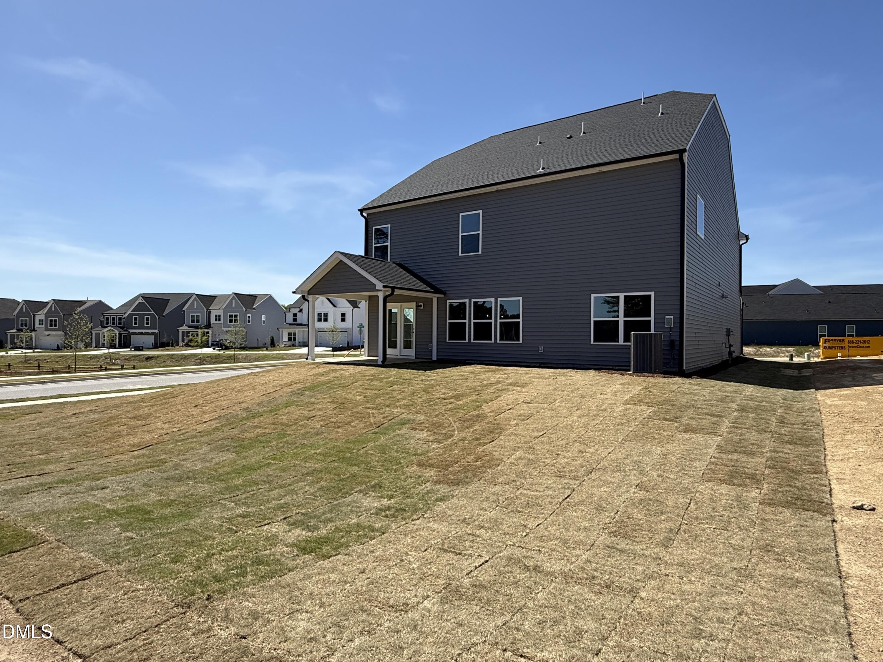 433 Contempo Court, Unit 3 Rolesville, NC 27571 - Photo 29 of 40 a front view of a house with a yard