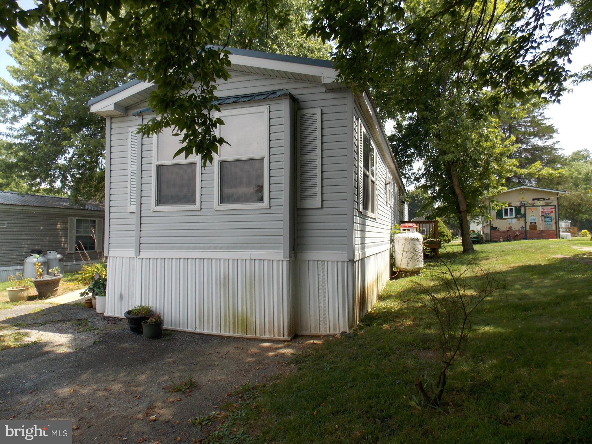 76 Big Spring Terrace Newville, PA 17241 - Photo 3 of 16 a view of a house with backyard and a tree