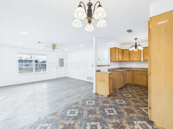 a view of kitchen with cabinets