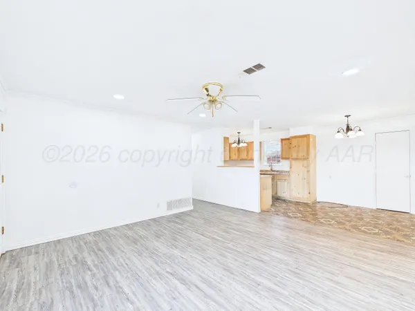 a view of a livingroom with wooden floor