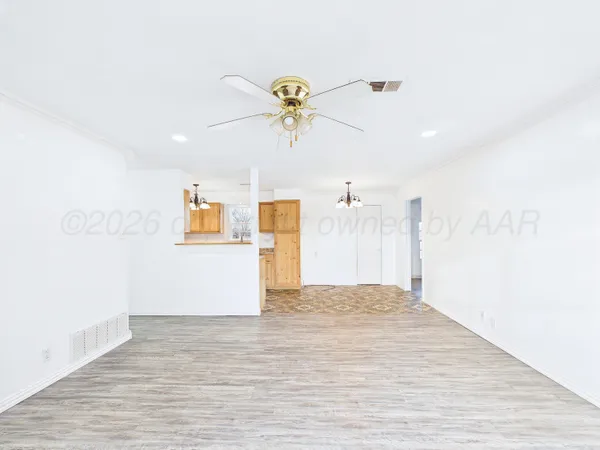 a view of a kitchen with a wooden floor