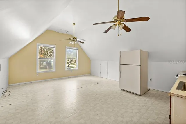 a view of a porch with a floor to ceiling window