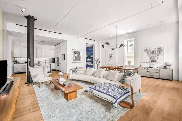 a living room with furniture rug and window