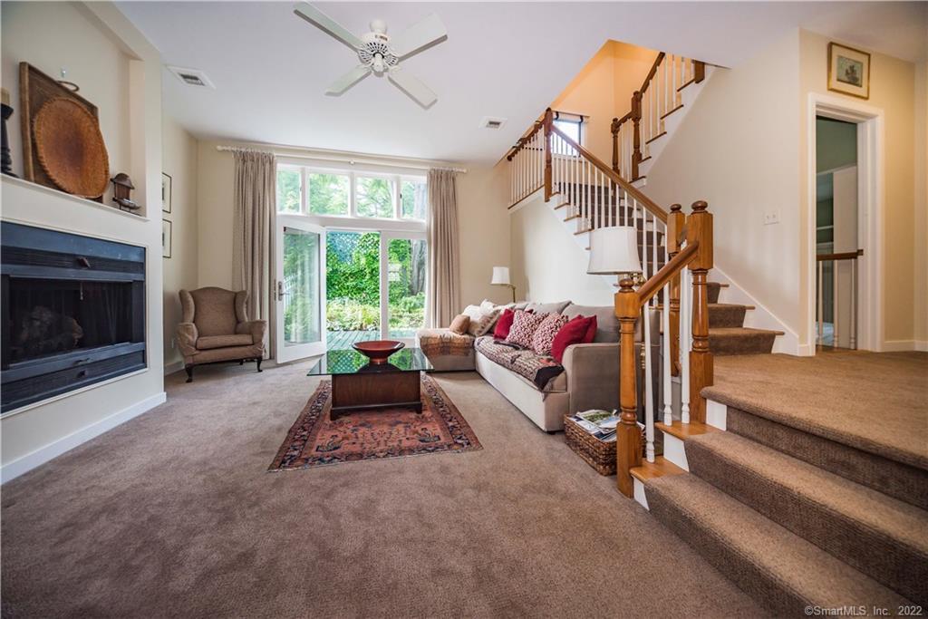 7 Great Elm Road Sharon, CT 06069 - Photo 1 of 1 Spacious living room with gas fireplace, high ceilings and French door to private deck.