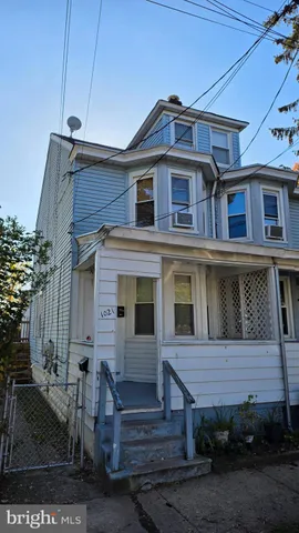 a view of a house with a small yard
