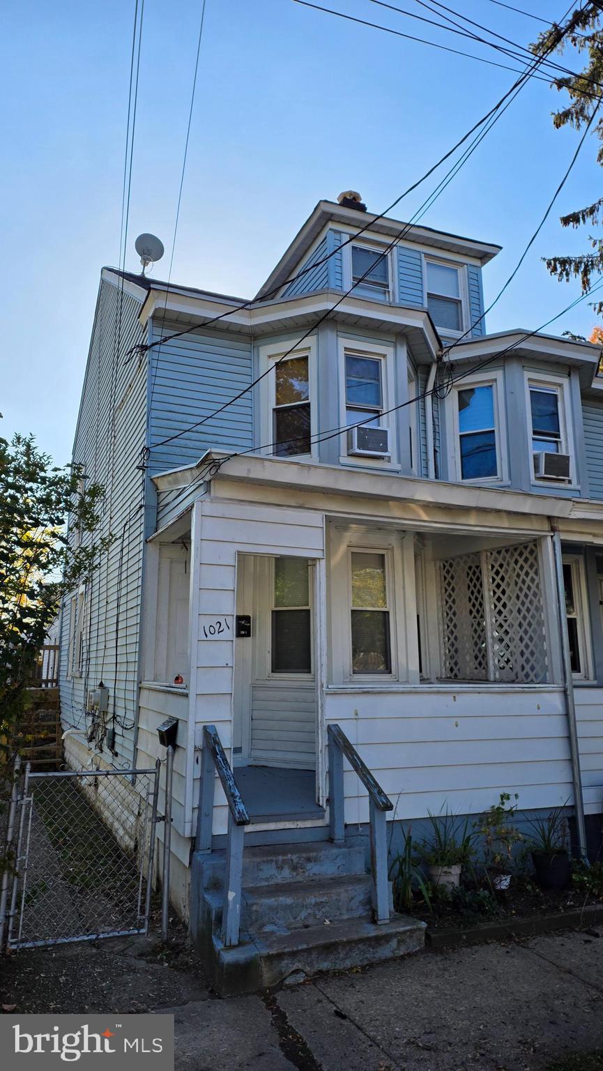 a view of a house with a small yard