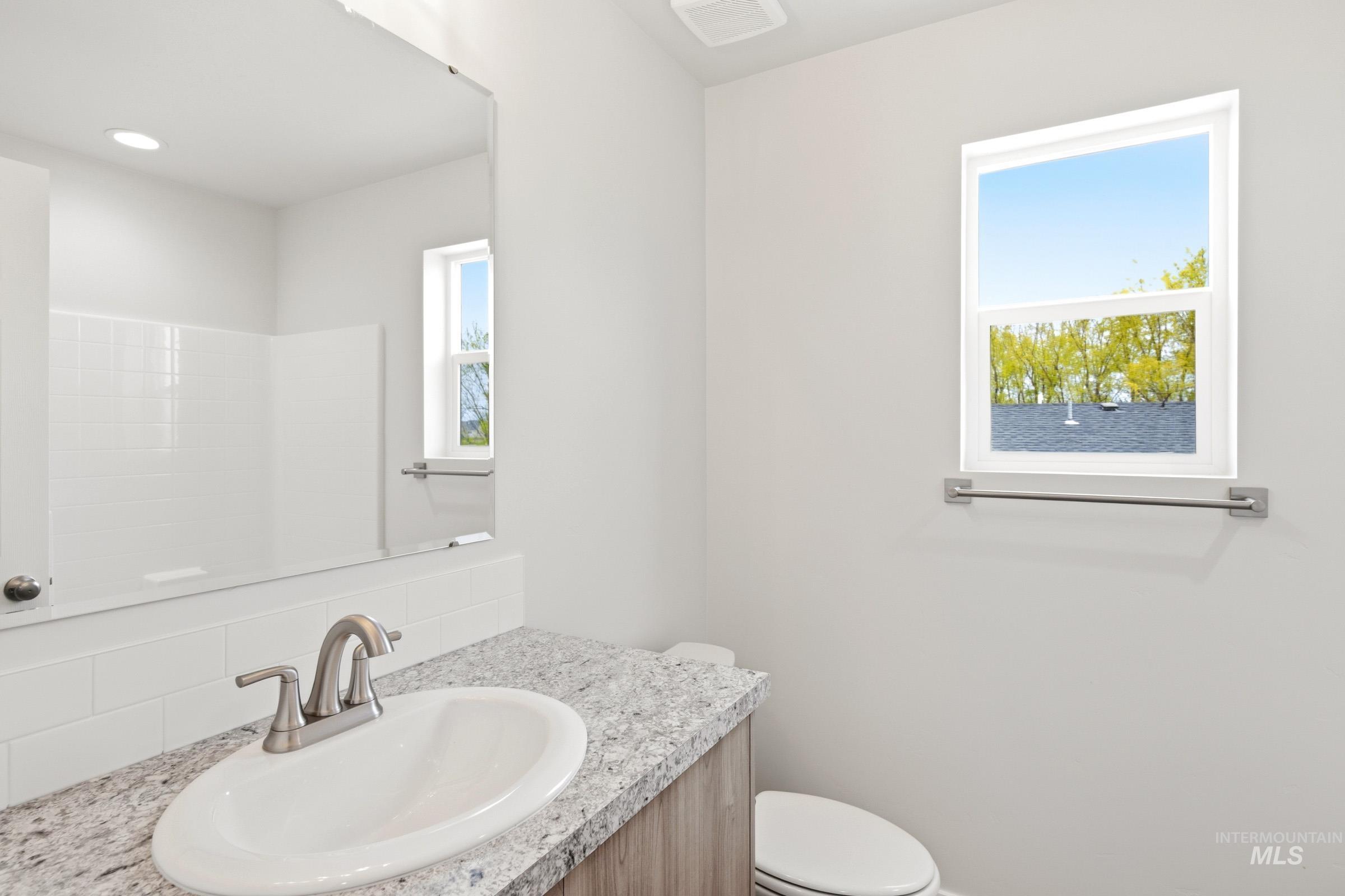 2446 West Fallon Loop Nampa, ID 83651 - Photo 12 of 19 Bathroom featuring toilet and vanity