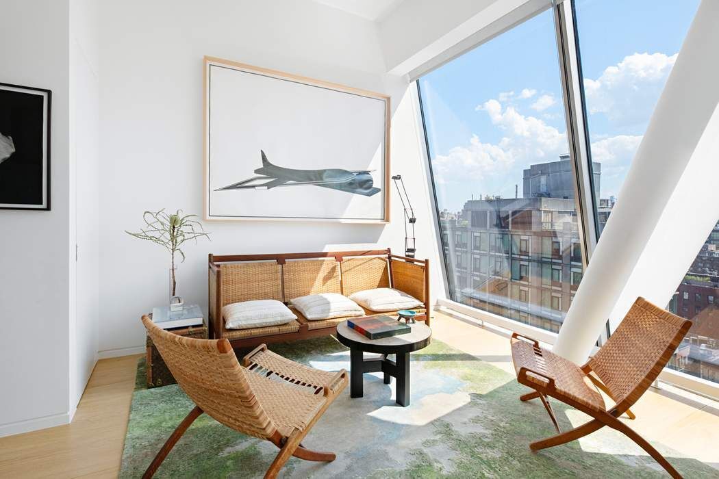 515 West 23rd Street, Unit PH Manhattan, NY 10011 - Photo 13 of 27 a living room with a couch and a table