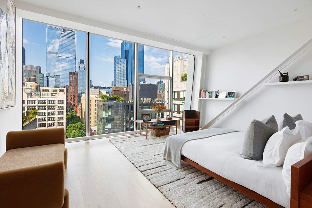 515 West 23rd Street, Unit PH Manhattan, NY 10011 - Photo 16 of 27 a living room with furniture and large windows
