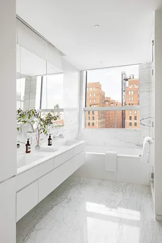 a bathroom with a bathtub and a sink