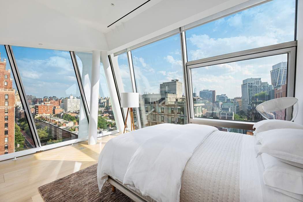 515 West 23rd Street, Unit PH Manhattan, NY 10011 - Photo 18 of 27 a bedroom with a bed and a large window