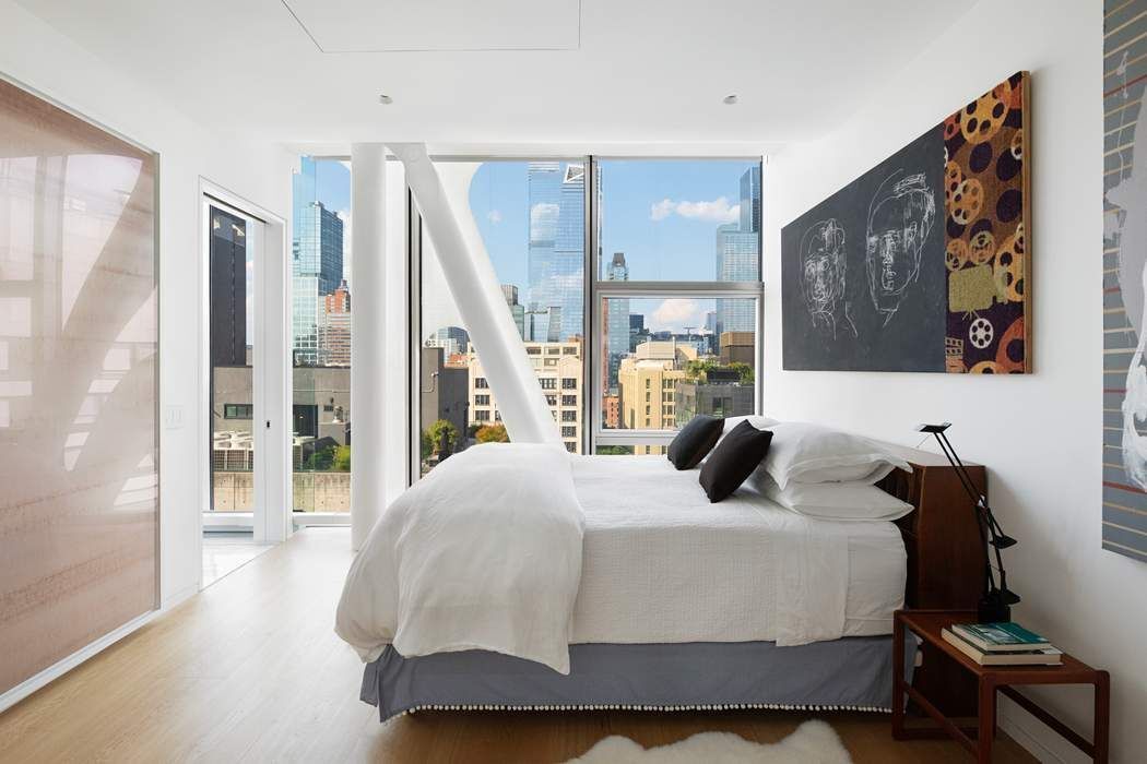 515 West 23rd Street, Unit PH Manhattan, NY 10011 - Photo 22 of 27 a bedroom with a bed and wooden floor