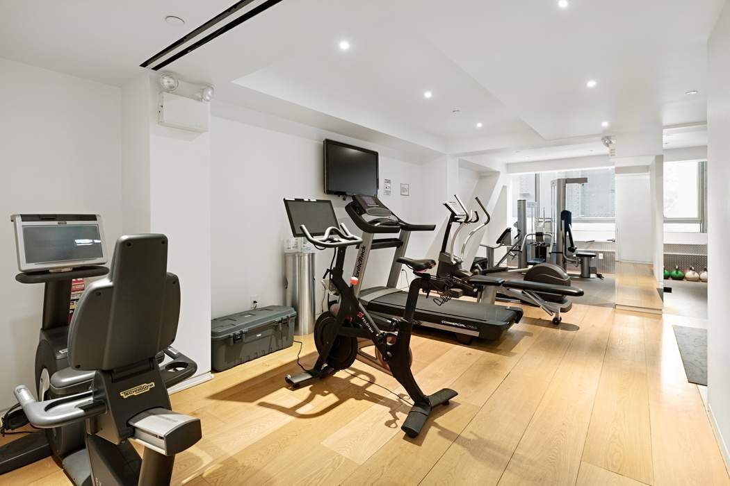 515 West 23rd Street, Unit PH Manhattan, NY 10011 - Photo 24 of 27 a view of a room with gym equipment