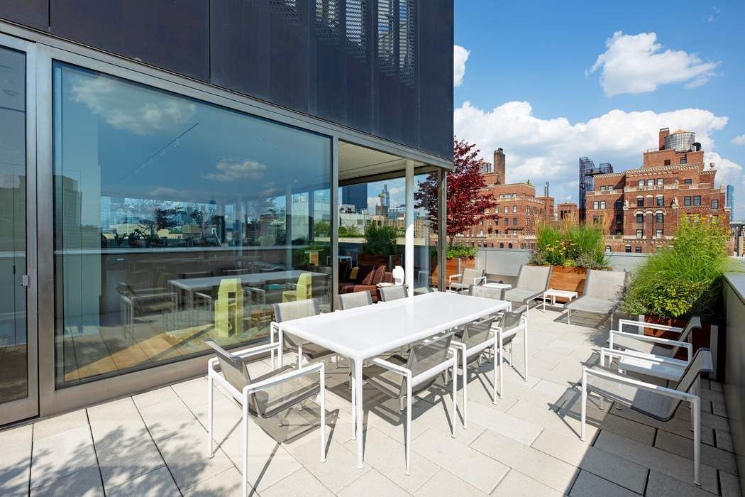 515 West 23rd Street, Unit PH Manhattan, NY 10011 - Photo 4 of 27 a view of a patio with a table and chairs