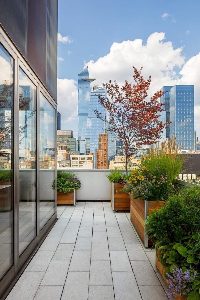 515 West 23rd Street, Unit PH Manhattan, NY 10011 - Photo 6 of 27 a view of a patio with couches and potted plants